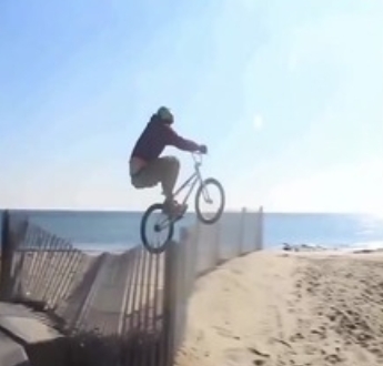 Mountain biker driving through the dunes